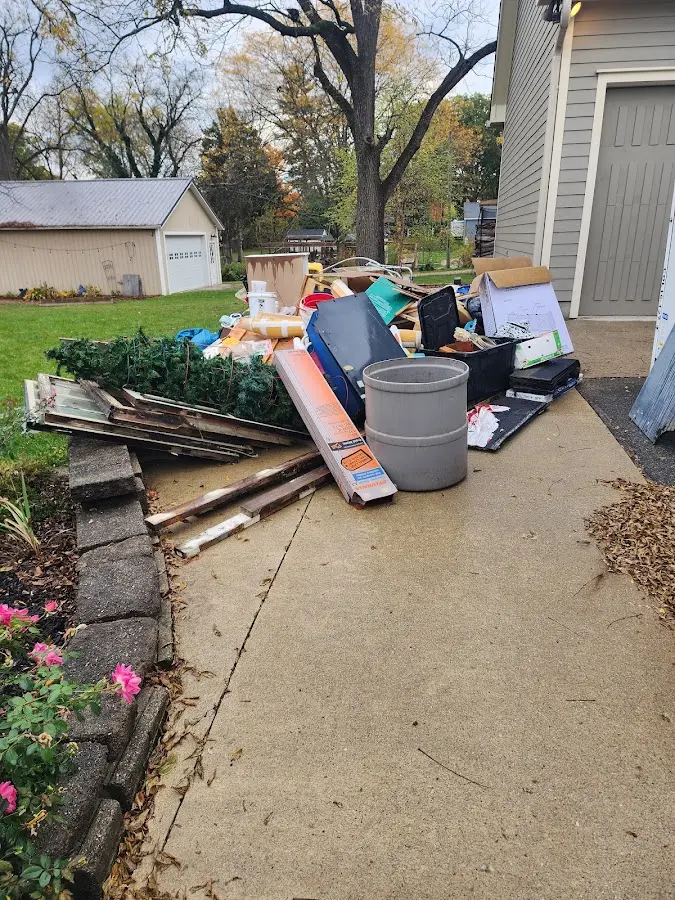 Dumpster being loaded with debris for 30 Yard Dumpster Rental in Avondale Estates